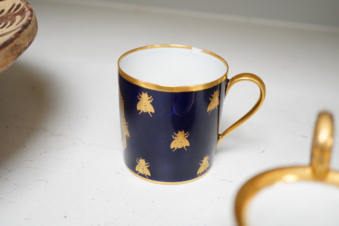 A 19th century Sevres style Napoleon cup, together with a similar cup and saucer and a Naples cup and saucer, cup 8cm from top of handle to base.
